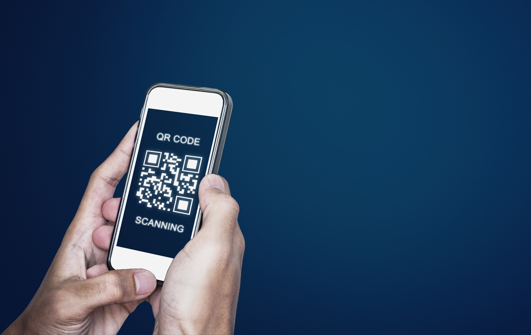 QR code scanning payment and verification. Hand using mobile smart phone scan QR code